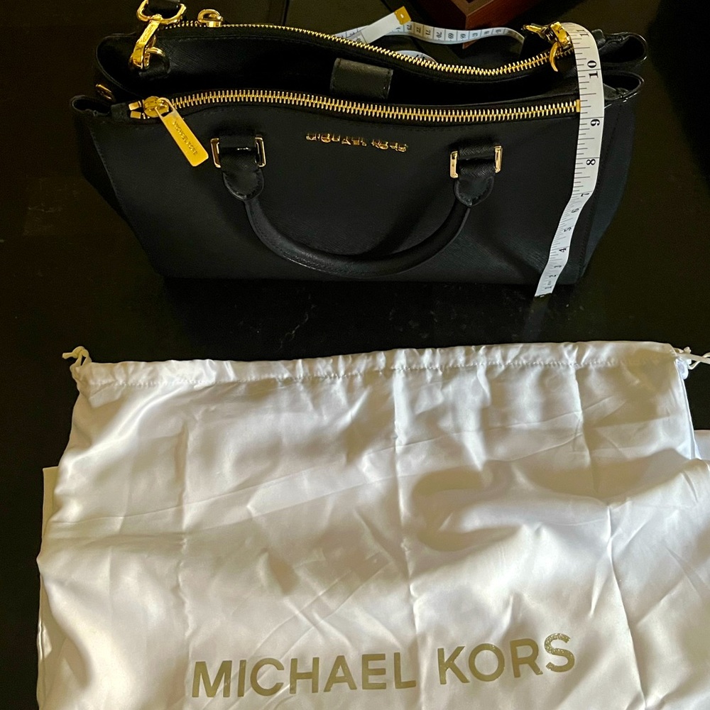 Like new, Michael Kors Handbag, Black with gold zipper/button, lots of room
